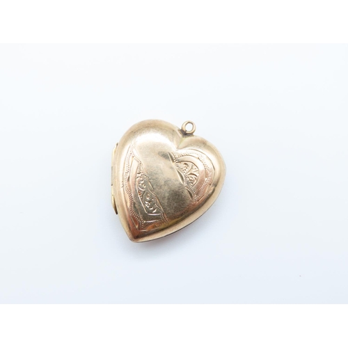 243 - 9 Carat Heart Motif Locket Pendant Incised Detailing Hinged Cover 2cm High