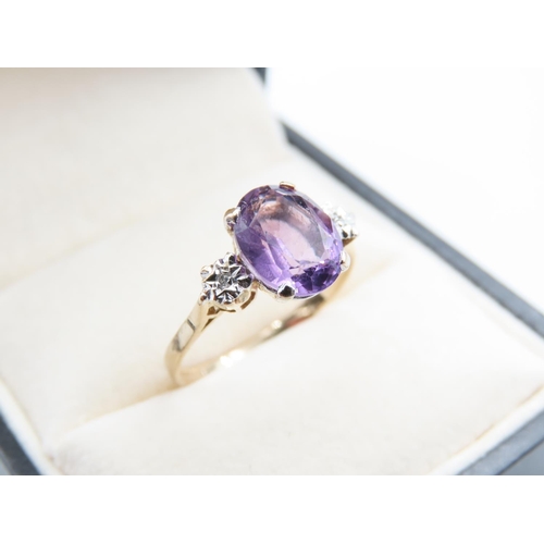 244 - Amethyst and Diamond Ladies Centre Stone Ring Mounted on 9 Carat Yellow Gold Band Ring Size O