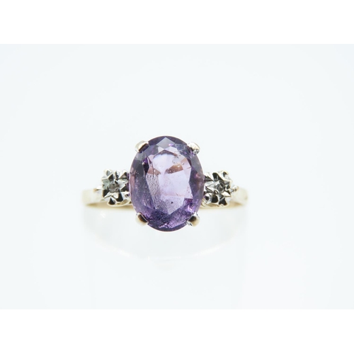 244 - Amethyst and Diamond Ladies Centre Stone Ring Mounted on 9 Carat Yellow Gold Band Ring Size O