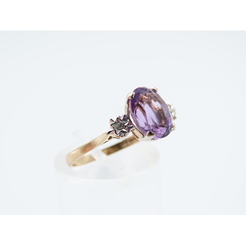 244 - Amethyst and Diamond Ladies Centre Stone Ring Mounted on 9 Carat Yellow Gold Band Ring Size O