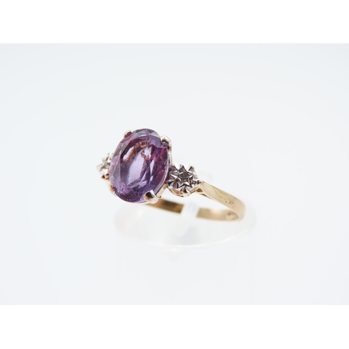 244 - Amethyst and Diamond Ladies Centre Stone Ring Mounted on 9 Carat Yellow Gold Band Ring Size O