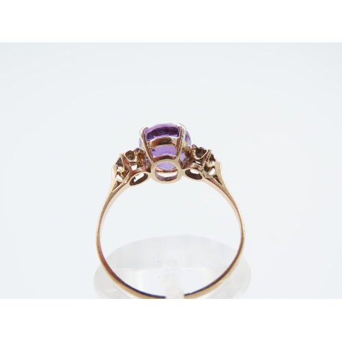 244 - Amethyst and Diamond Ladies Centre Stone Ring Mounted on 9 Carat Yellow Gold Band Ring Size O