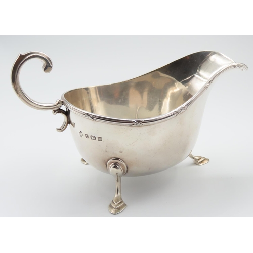 340 - Silver Sauceboat Flying C Scroll Handle above Shaped Supports Cross Ribbon Detailing to Rim 16cm Wid... 