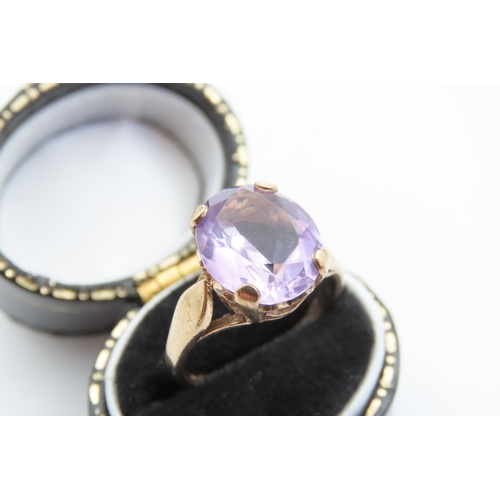 40 - Amethyst Ladies Centre Stone Ring Even Hue Four Claw Setting Mounted on 9 Carat Yellow Gold Band Rin... 