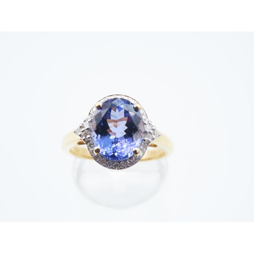 47 - Tanzanite and Diamond Set Ladies Centre Stone Ring Mounted on 18 Carat Yellow Gold Band Ring Size Q