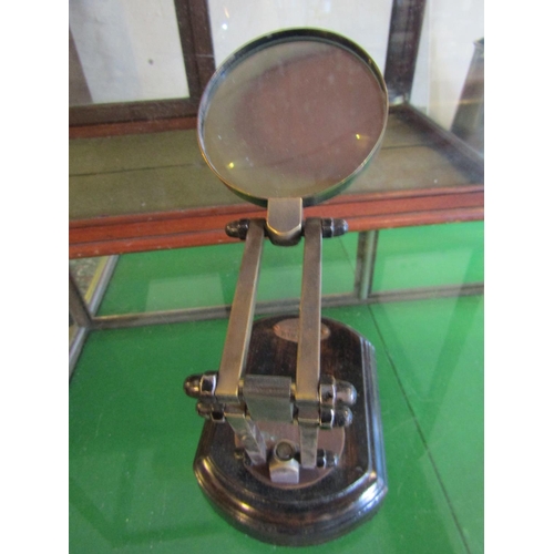 697 - Desk Top Magnifying Glass of Neat Size Approximately 7 Inches High Adjustable Bronze Arm