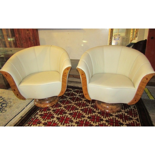 700 - Pair of Maple Framed Cream Leather Upholstered Modernist Form Armchairs Generous Size Swivel Bases