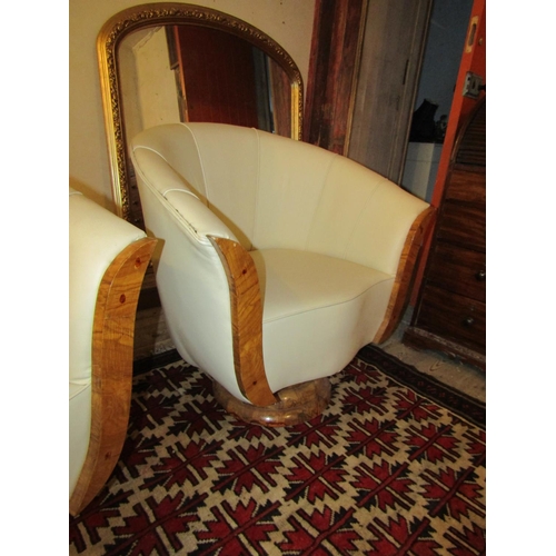 700 - Pair of Maple Framed Cream Leather Upholstered Modernist Form Armchairs Generous Size Swivel Bases