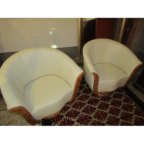 700 - Pair of Maple Framed Cream Leather Upholstered Modernist Form Armchairs Generous Size Swivel Bases