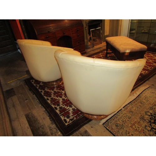 700 - Pair of Maple Framed Cream Leather Upholstered Modernist Form Armchairs Generous Size Swivel Bases