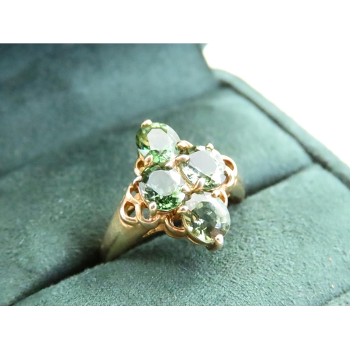 73 - Four Stone Peridot Ladies Ring Mounted on 9 Carat Yellow Gold Band Ring Size N and a Half