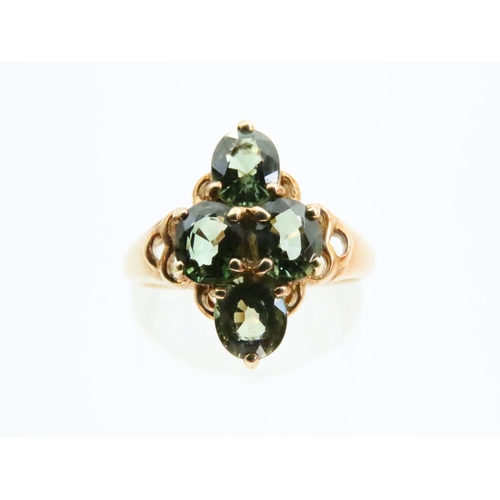 73 - Four Stone Peridot Ladies Ring Mounted on 9 Carat Yellow Gold Band Ring Size N and a Half