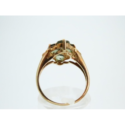 73 - Four Stone Peridot Ladies Ring Mounted on 9 Carat Yellow Gold Band Ring Size N and a Half