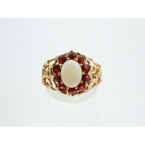 78 - Opal and Red Garnet Ladies Cluster Ring Mounted on 18 Carat Yellow Gold Band Ring Size O