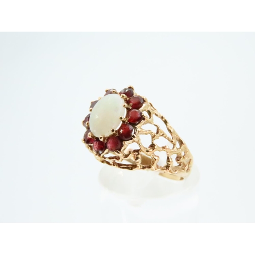 78 - Opal and Red Garnet Ladies Cluster Ring Mounted on 18 Carat Yellow Gold Band Ring Size O