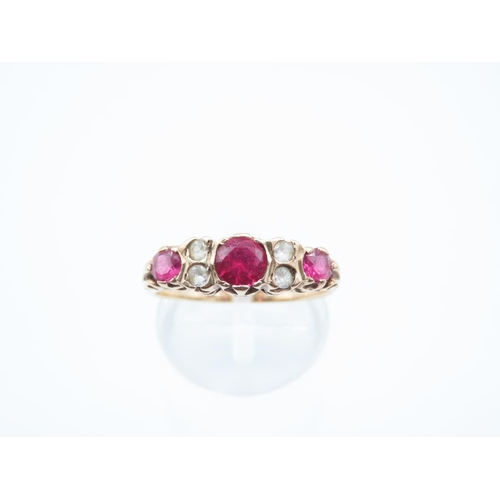 8 - Three Stone Ladies Ruby Ring Mounted on 9 Carat Yellow Gold Ring Size Q
