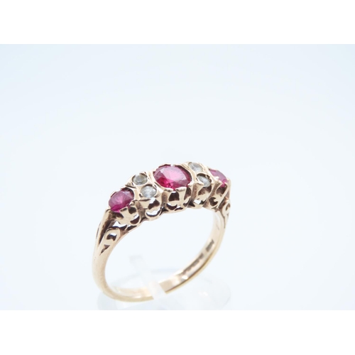 8 - Three Stone Ladies Ruby Ring Mounted on 9 Carat Yellow Gold Ring Size Q