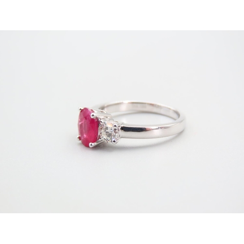 101 - Ruby Centre Stone Ring with Diamonds to Either Shoulder Mounted on 18 Carat White Gold Ring Size N