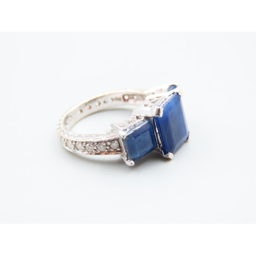 147 - Sapphire and Diamond Three Stone Ring Further Set Diamonds to Shoulders Mounted on 14 Carat White Go... 