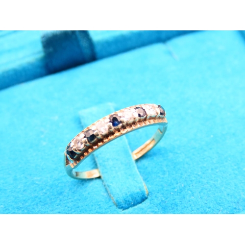 179 - Sapphire and Diamond Ladies Band Ring Mounted on 9 Carat Yellow Gold Ring Size M