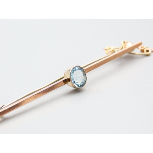 187 - 9 Carat Yellow Gold Ladies Bar Brooch Set with Oval Cut Aquamarine