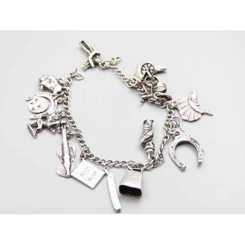 200 - Silver Charm Bracelet Antique Laden with Various Novelty Charms Including Swordfish, Unicycle, Dance... 