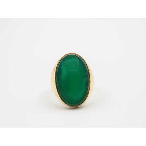 210 - Jade Set Oval Panel Ring Mounted on 18 Carat Yellow Gold Band Ring Size T