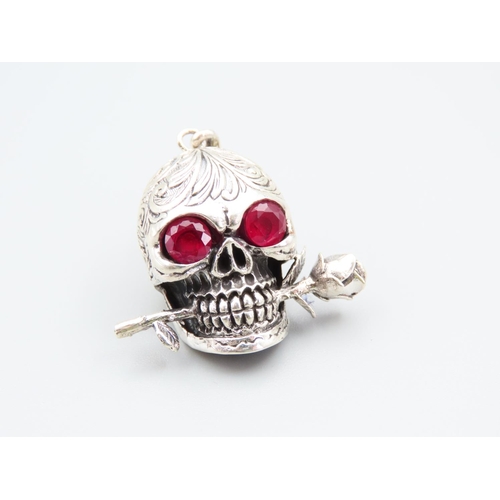 219 - Silver Skull and Rose Motif Pendant Ruby Set Eyes Incised Decoration Throughout 4cm High