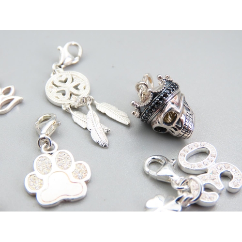 239 - Eleven Silver Bracelet Charms