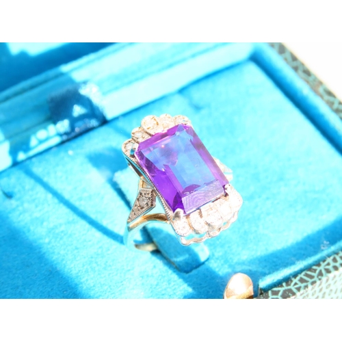 266 - Amethyst and Diamond Ladies Ring Emerald Cut Mounted on 9 Carat Yellow Gold Band Ring Size O