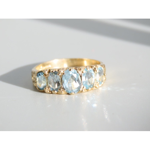 267 - Aquamarine Five Stone Ring Mounted on 9 Carat Yellow Gold Band Ring Size P