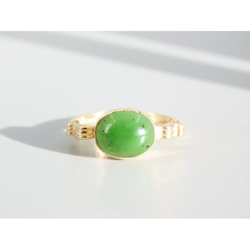 269 - Jade Cabochon Polished Oval Cut Centre Stone Ring Mounted on 9 Carat Yellow Gold Band Ring Size O an... 