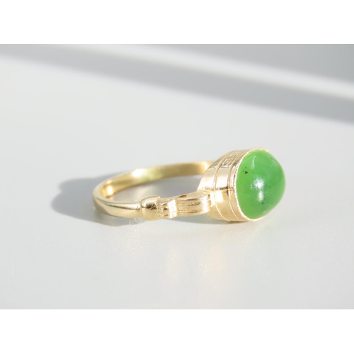 269 - Jade Cabochon Polished Oval Cut Centre Stone Ring Mounted on 9 Carat Yellow Gold Band Ring Size O an... 