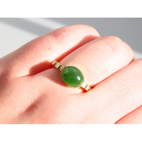 269 - Jade Cabochon Polished Oval Cut Centre Stone Ring Mounted on 9 Carat Yellow Gold Band Ring Size O an... 