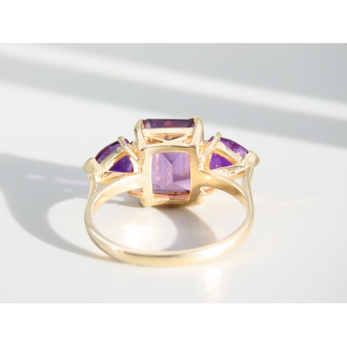 270 - Amethyst Three Stone Ring Mounted on 9 Carat Yellow Gold Band Ring Size N