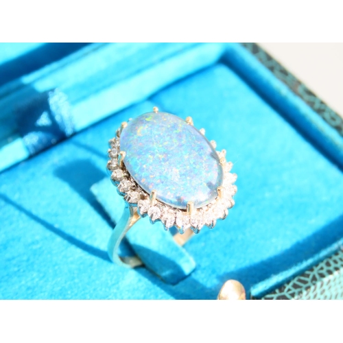 271 - Opal and Diamond Ladies Cluster Ring Mounted on 9 Carat Yellow Gold Band Ring Size O