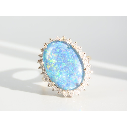 271 - Opal and Diamond Ladies Cluster Ring Mounted on 9 Carat Yellow Gold Band Ring Size O