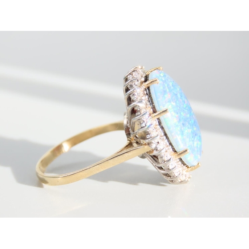 271 - Opal and Diamond Ladies Cluster Ring Mounted on 9 Carat Yellow Gold Band Ring Size O