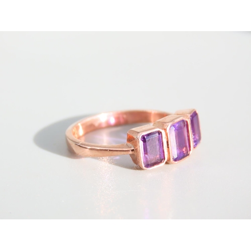 274 - Amethyst Three Stone Ring Mounted on 9 Carat Rose Gold Band Ring Size O