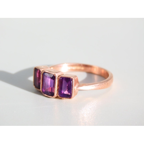 274 - Amethyst Three Stone Ring Mounted on 9 Carat Rose Gold Band Ring Size O