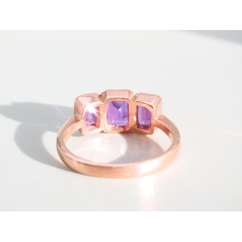 274 - Amethyst Three Stone Ring Mounted on 9 Carat Rose Gold Band Ring Size O