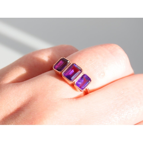 274 - Amethyst Three Stone Ring Mounted on 9 Carat Rose Gold Band Ring Size O