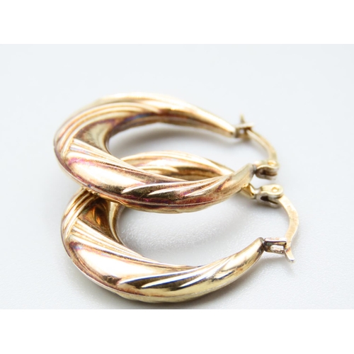 288 - Pair of 9 Carat Yellow Gold Ladies Hoop Earrings Incised Detailing Each Approximately 2cm Diameter