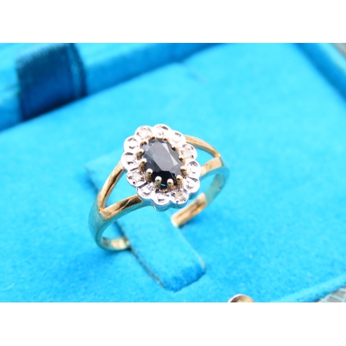 296 - Sapphire and Diamond Cluster Ring Mounted on 9 Carat Yellow Gold Band Ring Size M