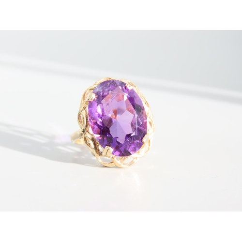 327 - Amethyst Centre Stone Ring Oval Facet Cut Set on 9 Carat Yellow Gold Band Ring Size O and A Half