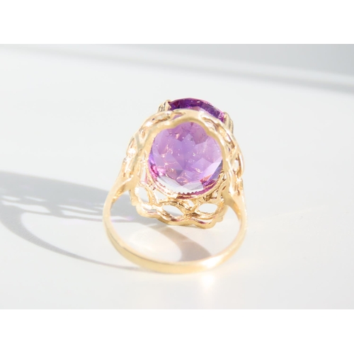 327 - Amethyst Centre Stone Ring Oval Facet Cut Set on 9 Carat Yellow Gold Band Ring Size O and A Half