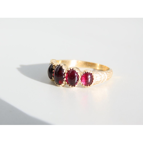 329 - Five Stone Cabochon Cut Polished Garnet Ring Mounted on 9 Carat Yellow Gold Band Ring Size P