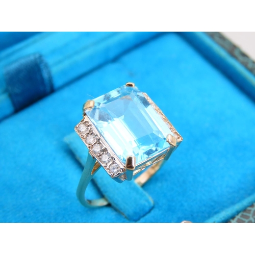 333 - Blue Topaz Emerald Cut Diamond Set Ring Mounted on 9 Carat Yellow Gold Band Ring Size O