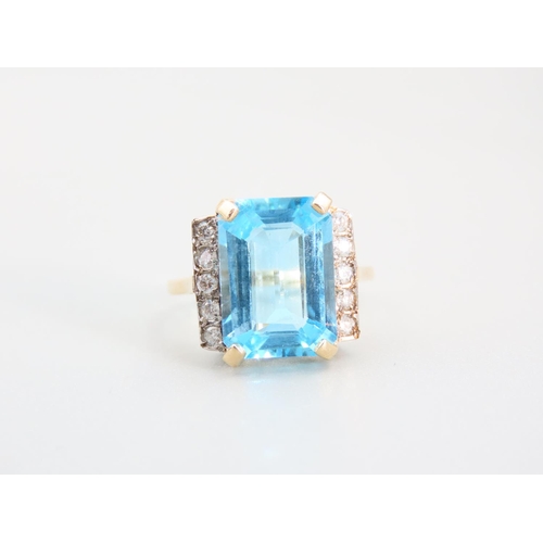 333 - Blue Topaz Emerald Cut Diamond Set Ring Mounted on 9 Carat Yellow Gold Band Ring Size O