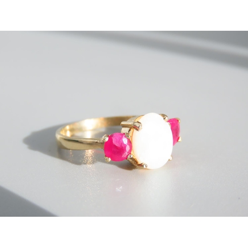 334 - Opal and Ruby Three Stone Ring Set on 9 Carat Yellow Gold Band Ring Size N